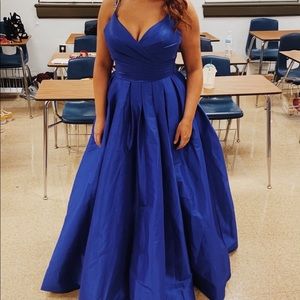 Royal blue ball gown with beaded shoulder straps.